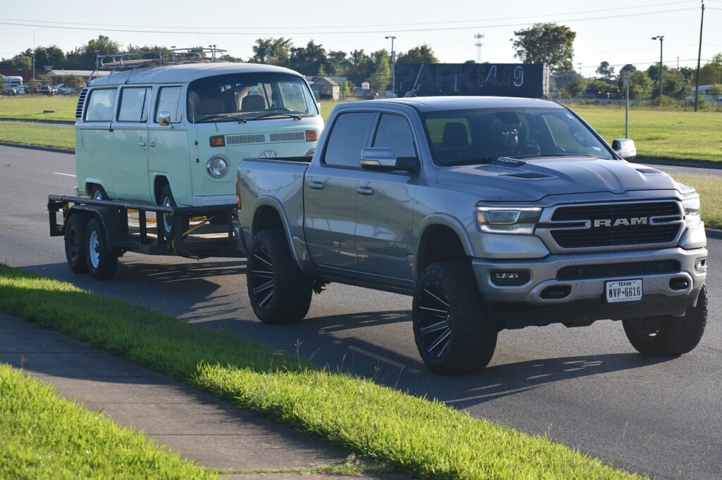 Truck and trailer backed down a boat ramp — how to back a boat trailer into a ramp step by step